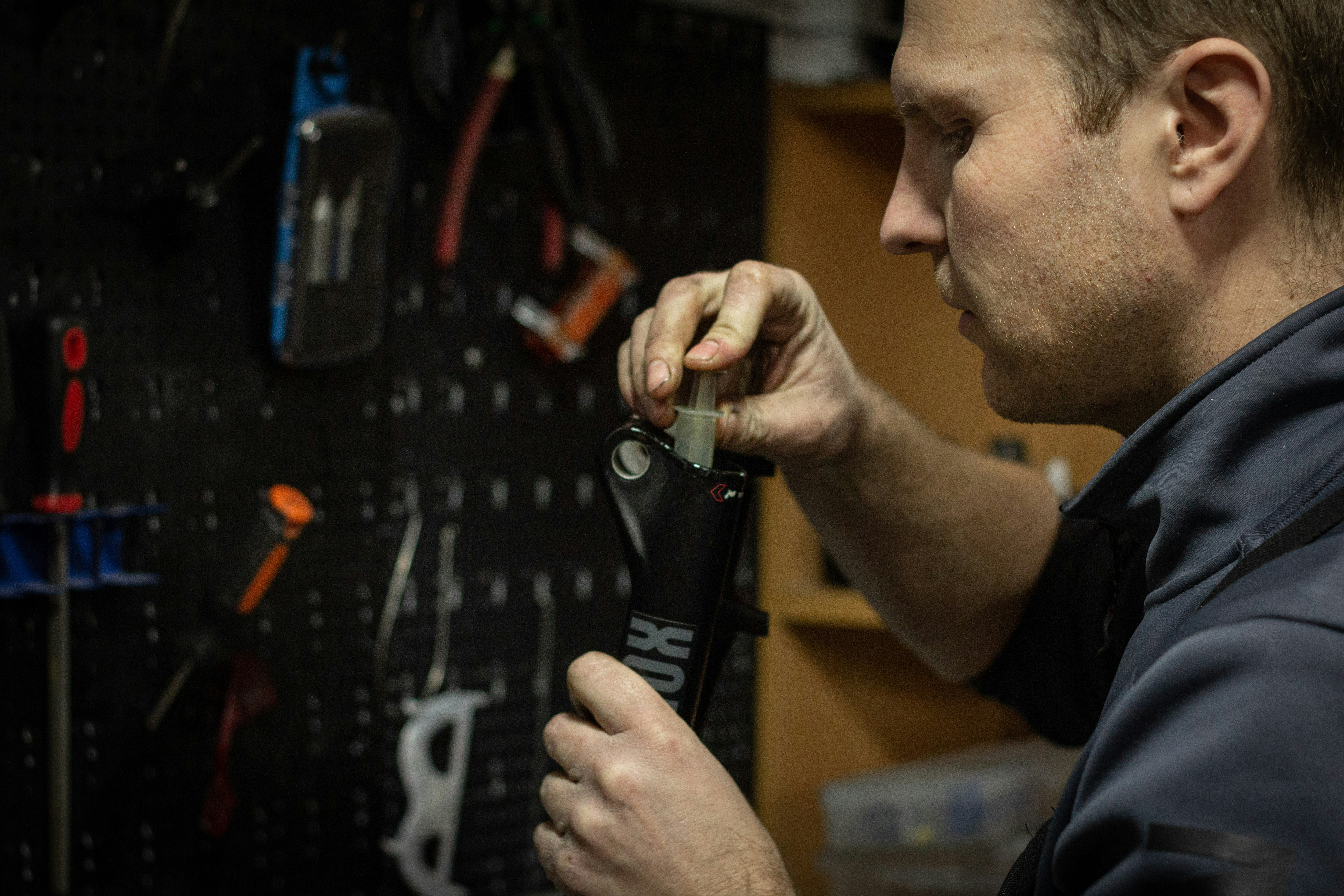 Technician performing a home assessment, measuring and inspecting HVAC components - furnace replacement cost