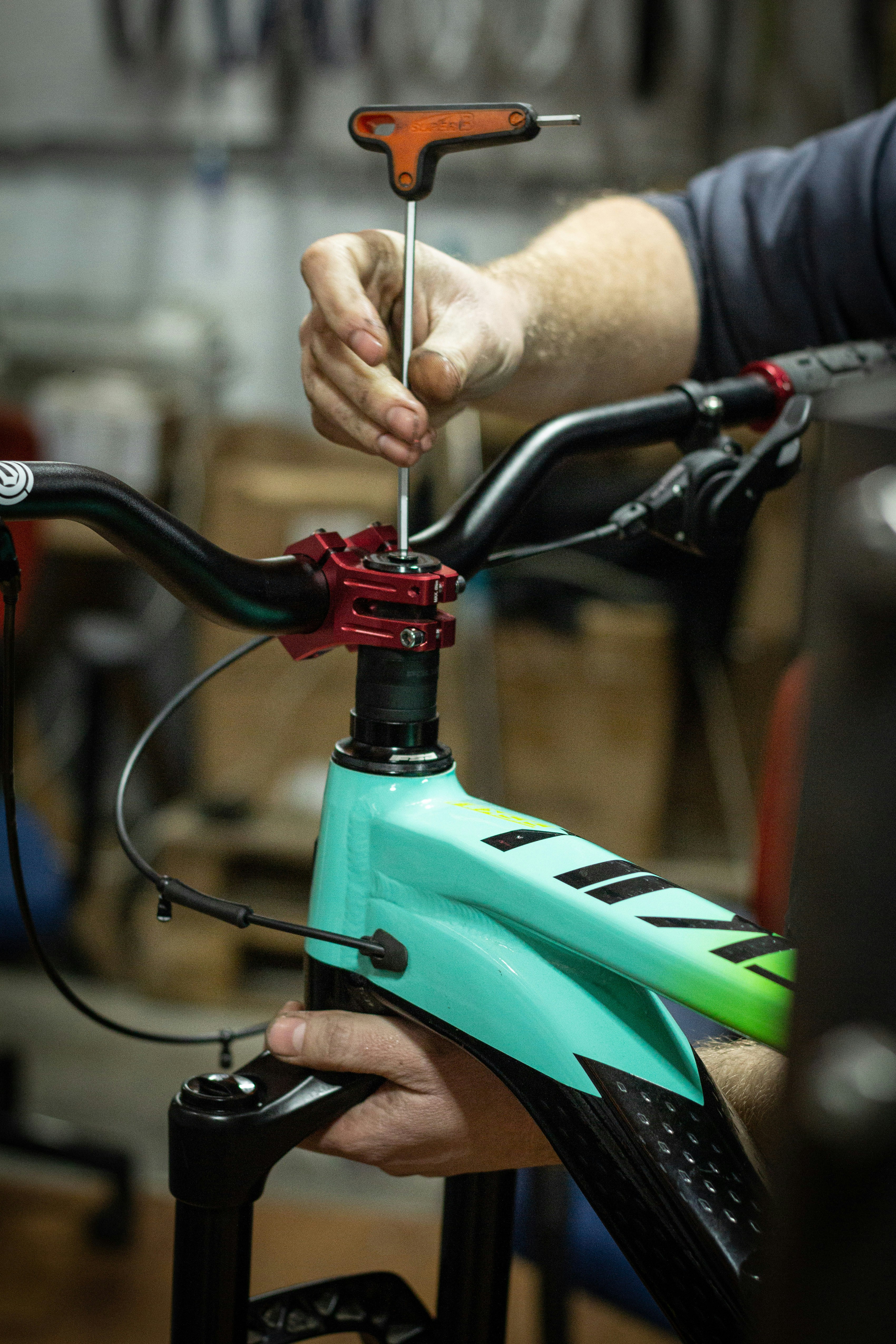 a close up of a person working on a bike