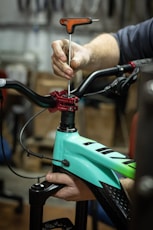 a close up of a person working on a bike