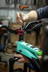 a close up of a person working on a bike