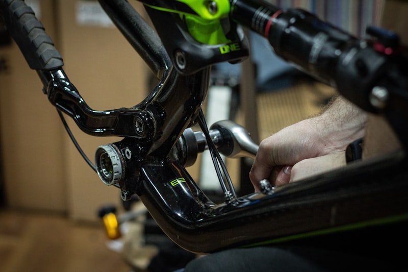 Mechanic adjusting a bicycle component