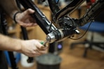 a close up of a person working on a bike