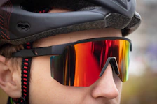 a close up of a person wearing a helmet and sunglasses
