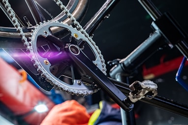 a close up of a bike with a purple light