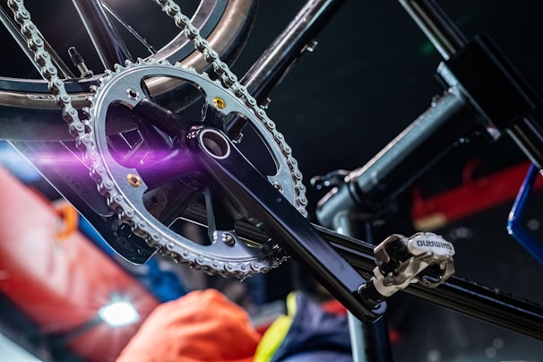 a close up of a bike with a purple light