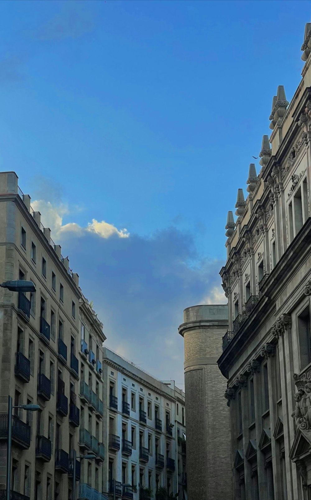 a clock on the side of a building in a city