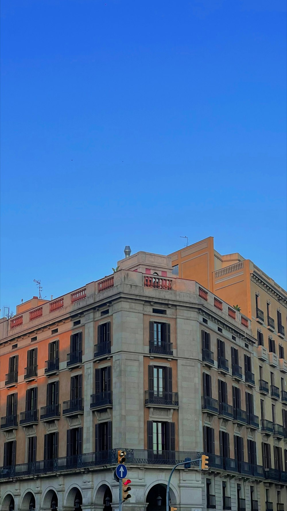 a tall building sitting next to a traffic light