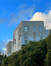 a tall building with a clock on the side of it