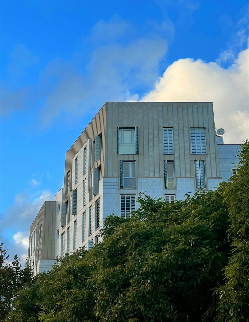 a tall building with a clock on the side of it