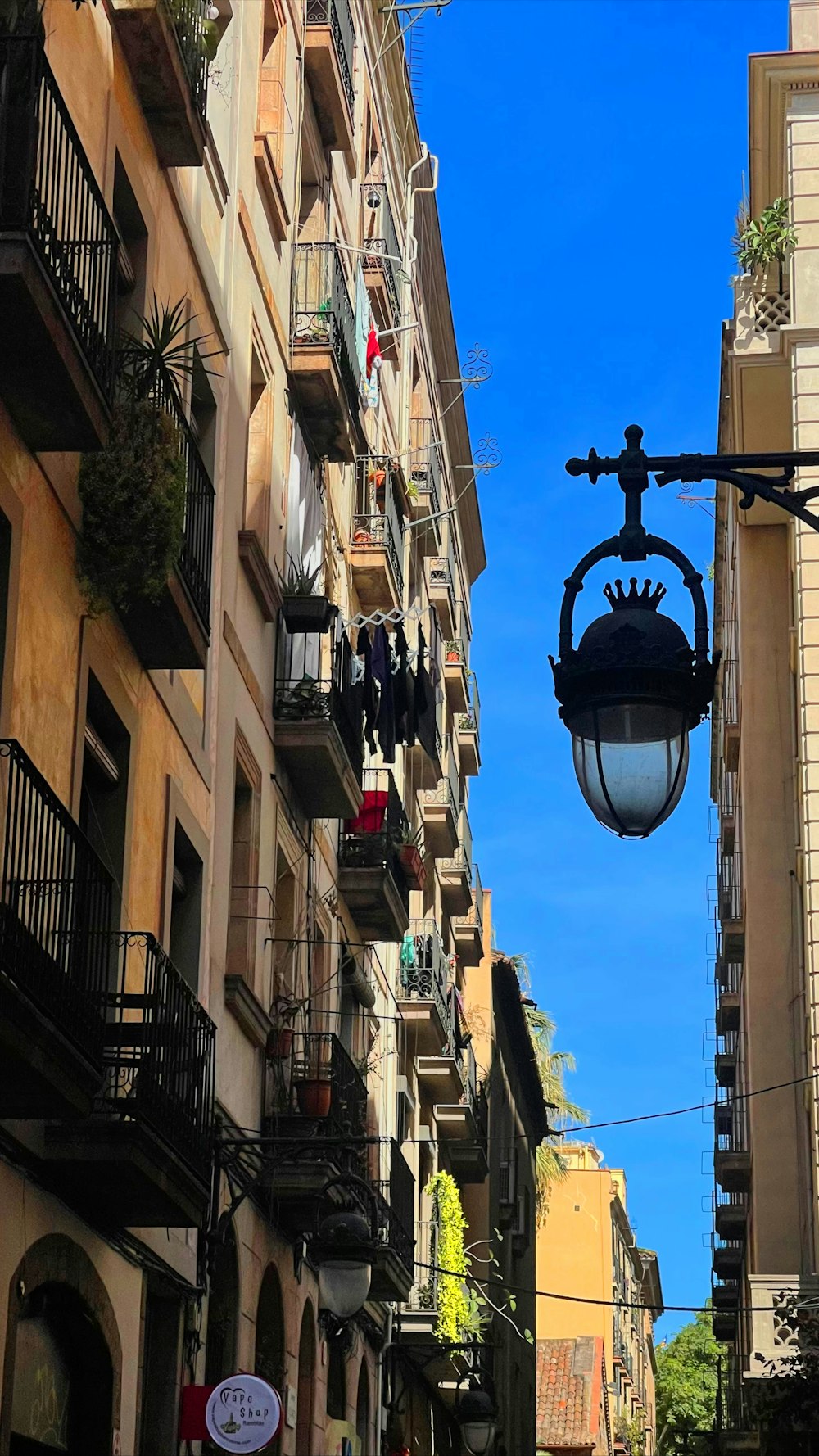 a street light hanging from the side of a building