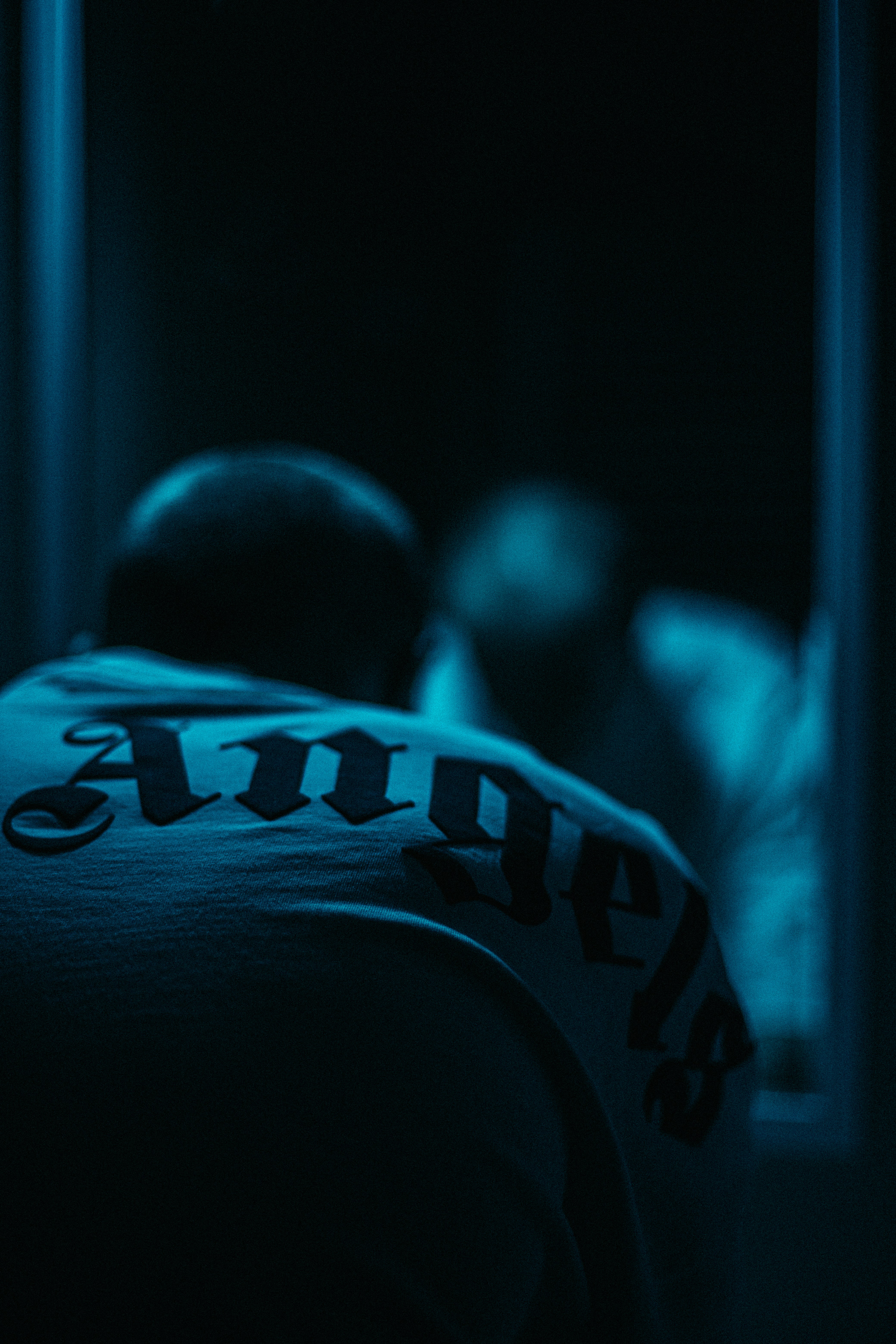 a baseball player in the dark with a bat