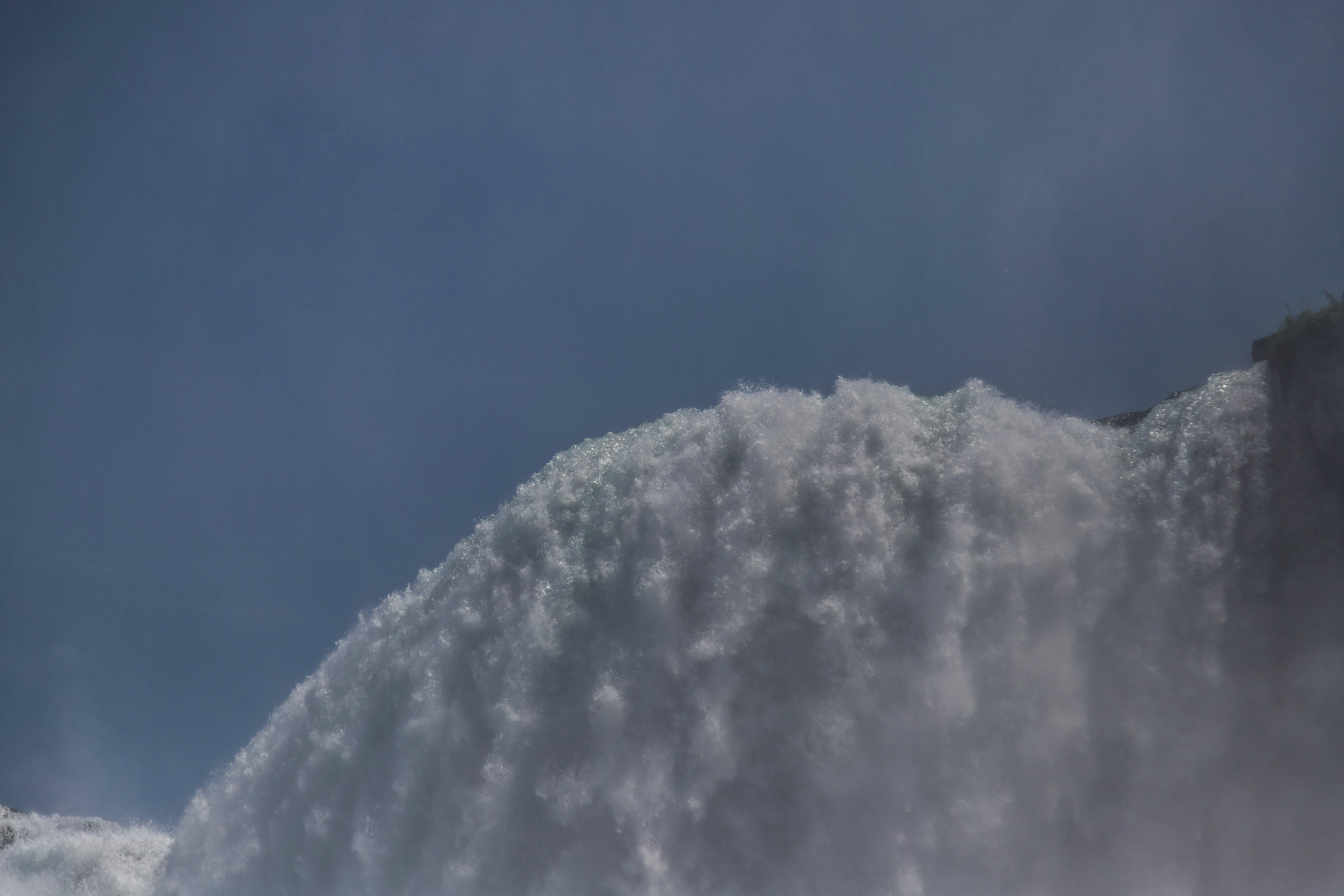 a large waterfall spewing water into the air