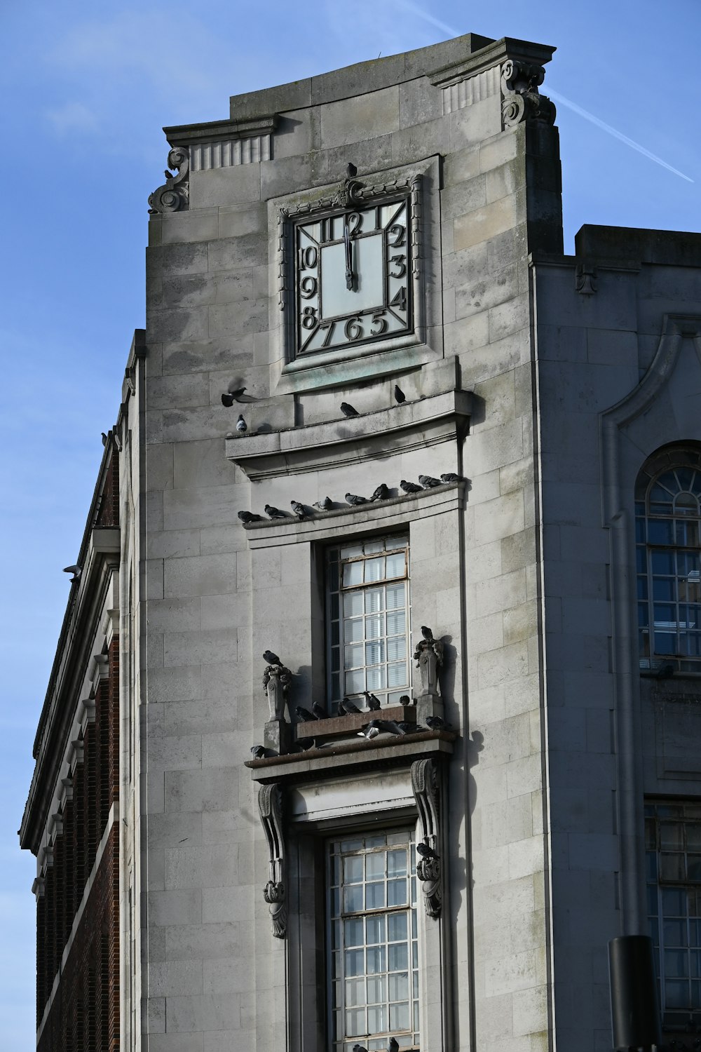 a tall building with a clock on the side of it