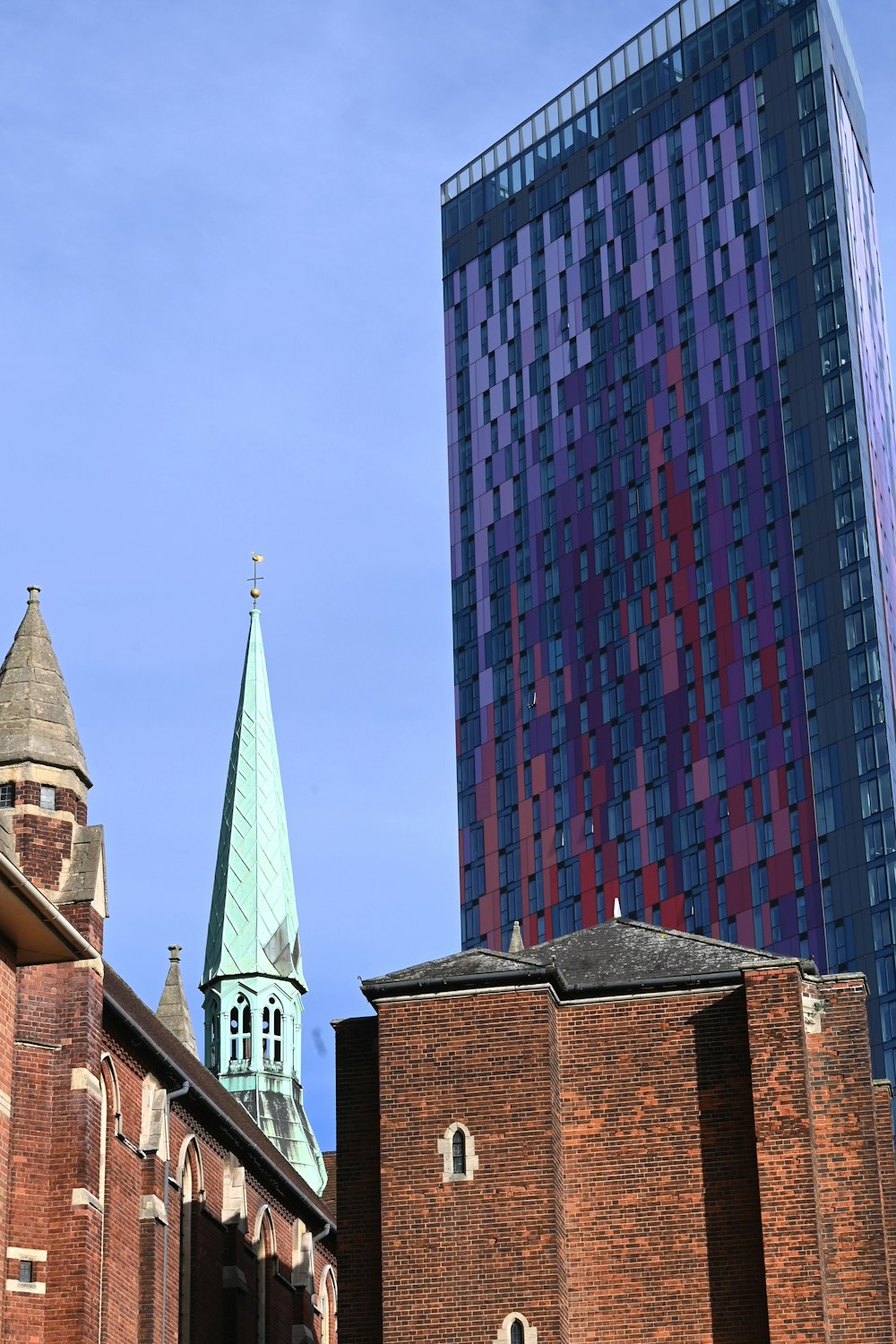 a church steeple with a blue sky in the background