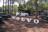 Volvo logo on a rugged SUV parked outdoors.