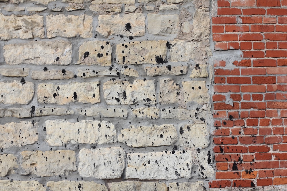 a close up of a brick wall with holes in it