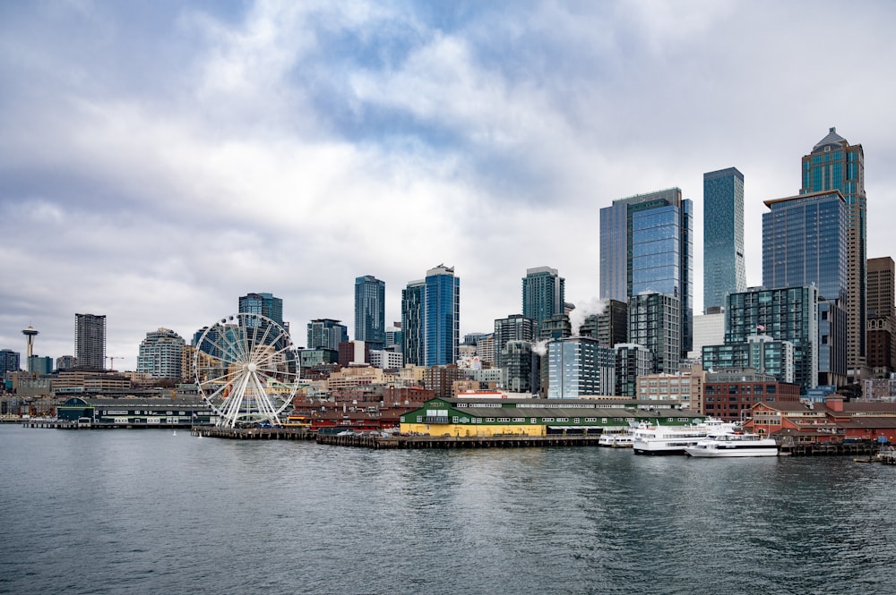 a large body of water with a city in the background