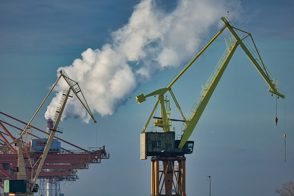 a large crane with smoke coming out of it