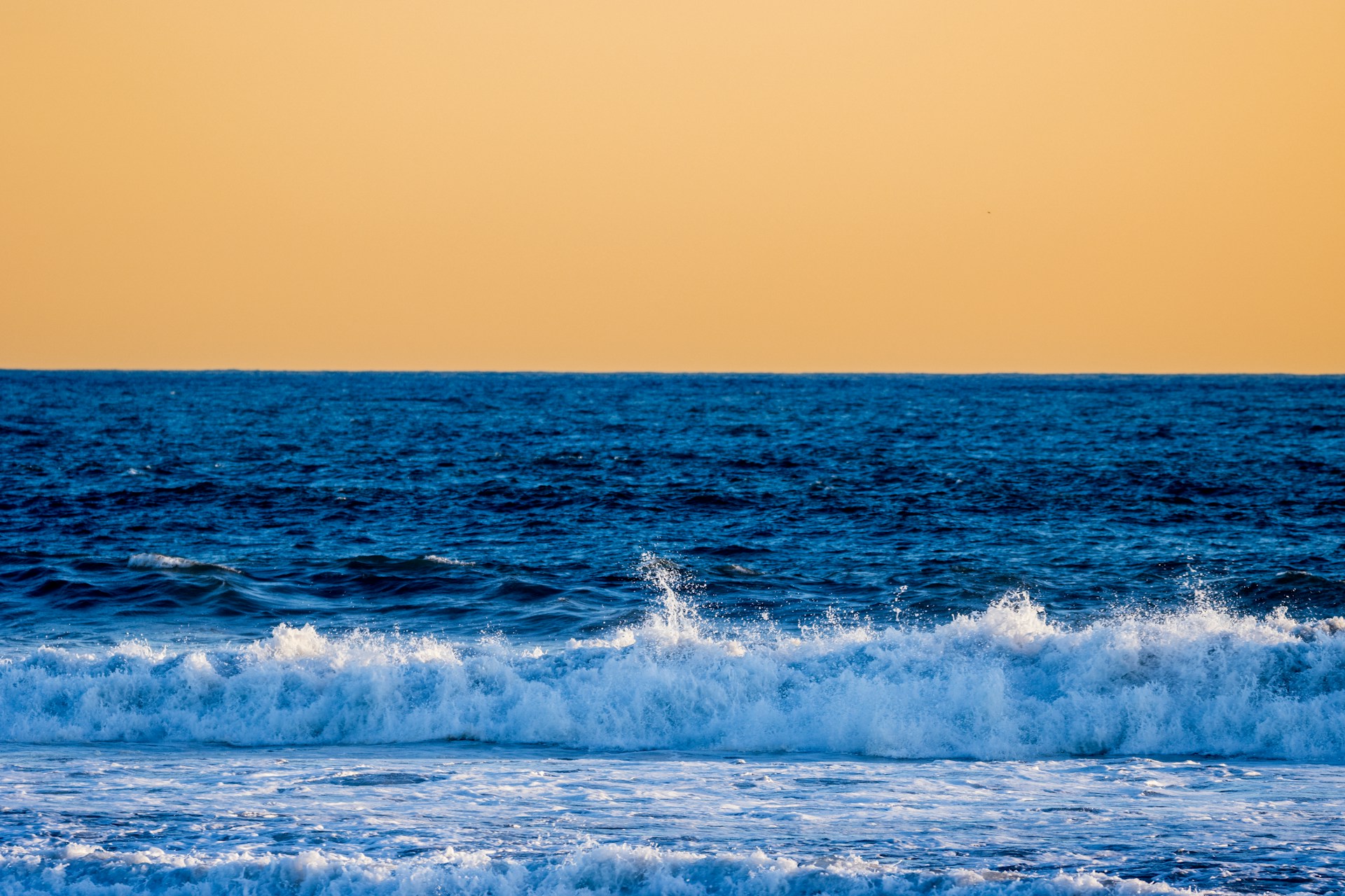 a person riding a surfboard on a wave in the ocean
