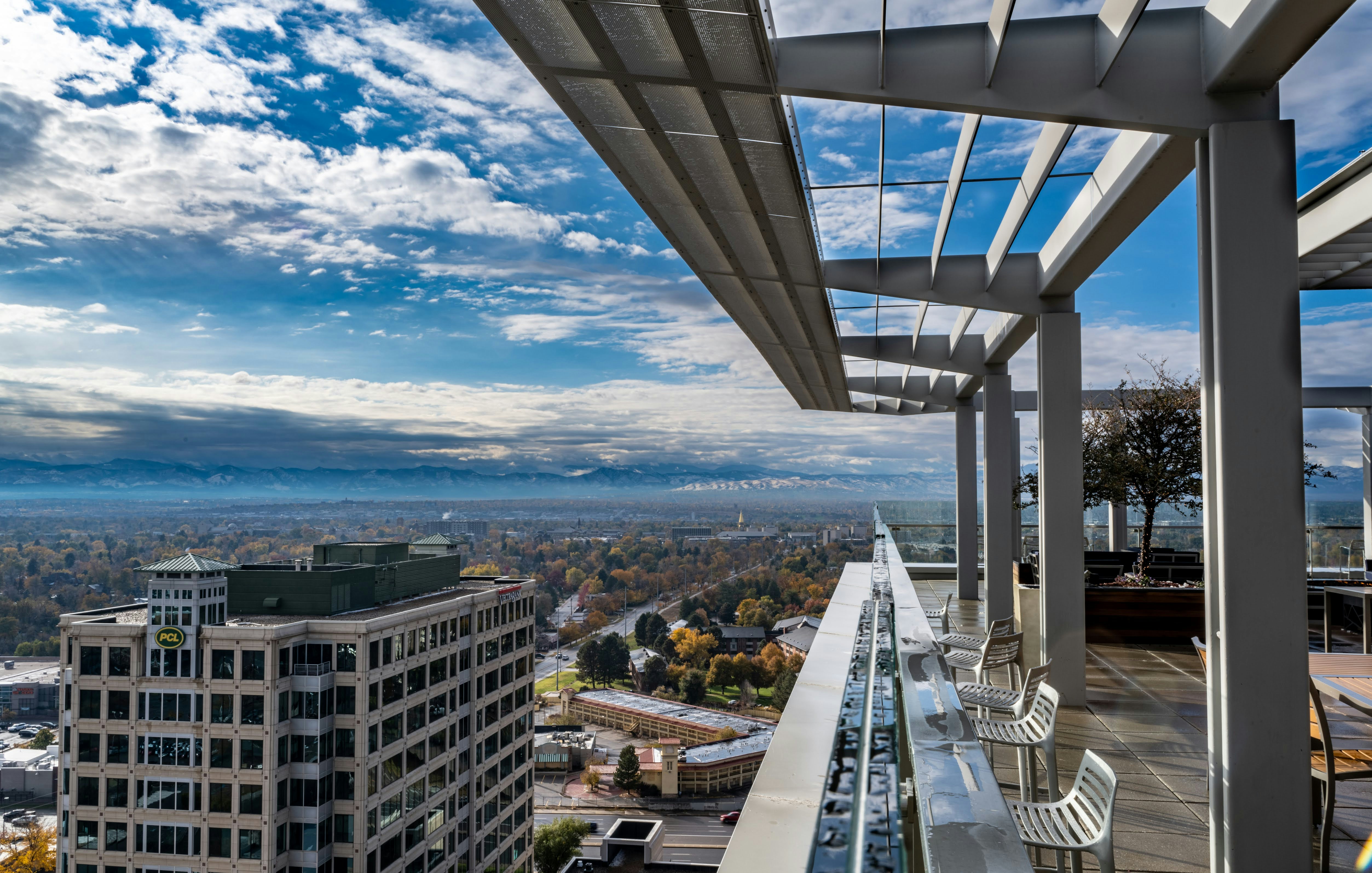 a balcony with a view of the city below