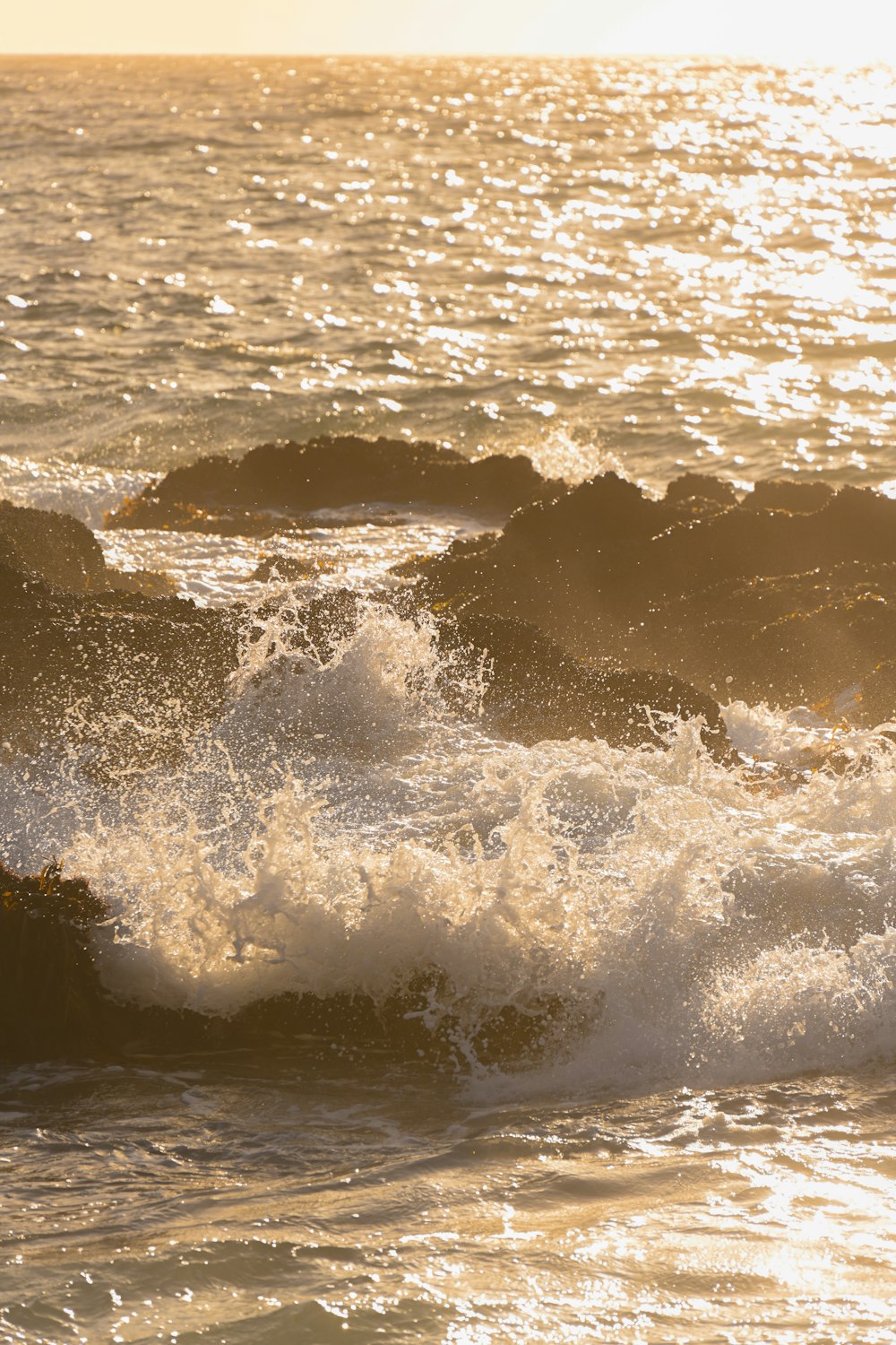 a man riding a surfboard on top of a wave in the ocean