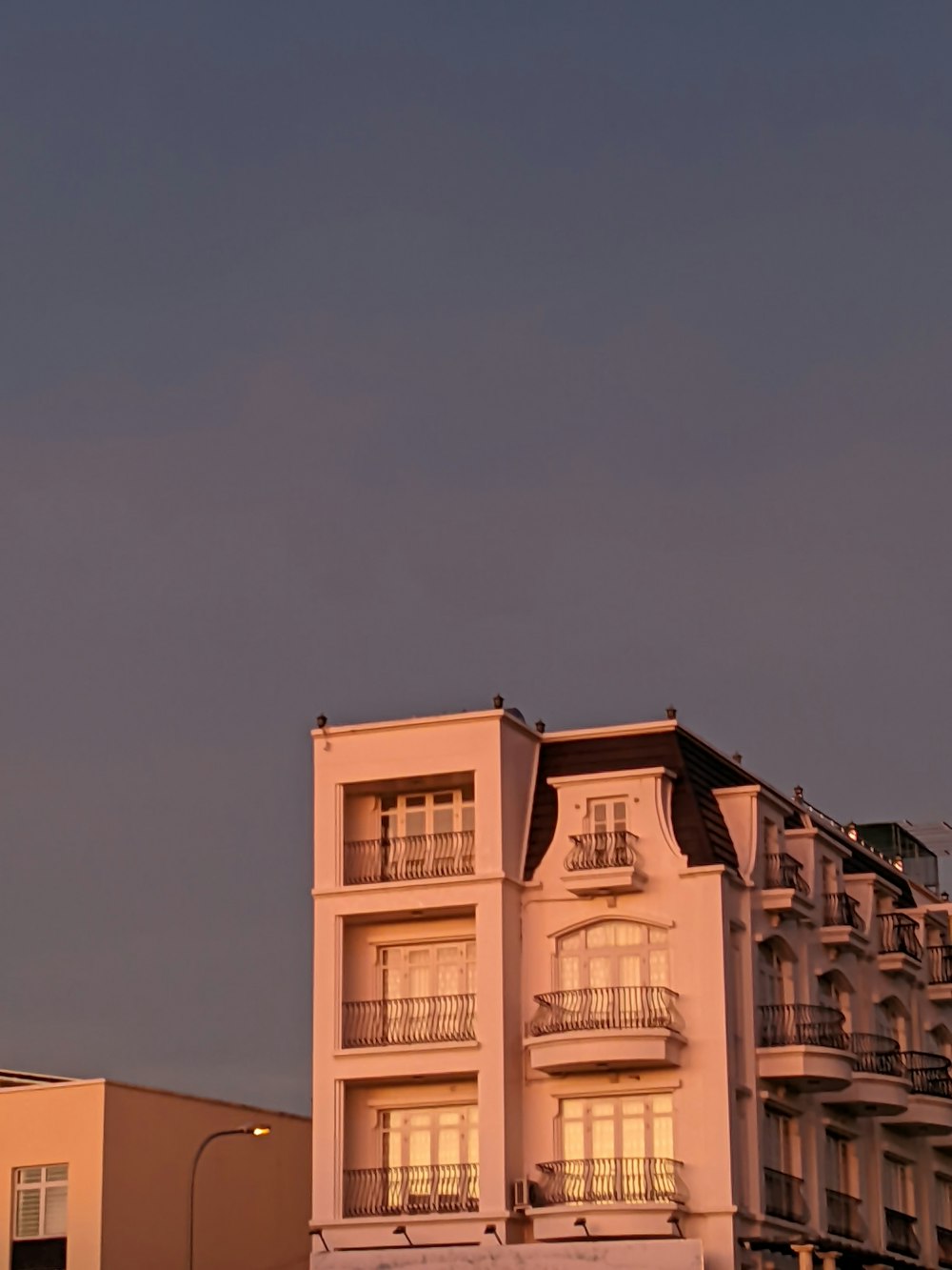 a tall building with balconies and balconies on the balconies