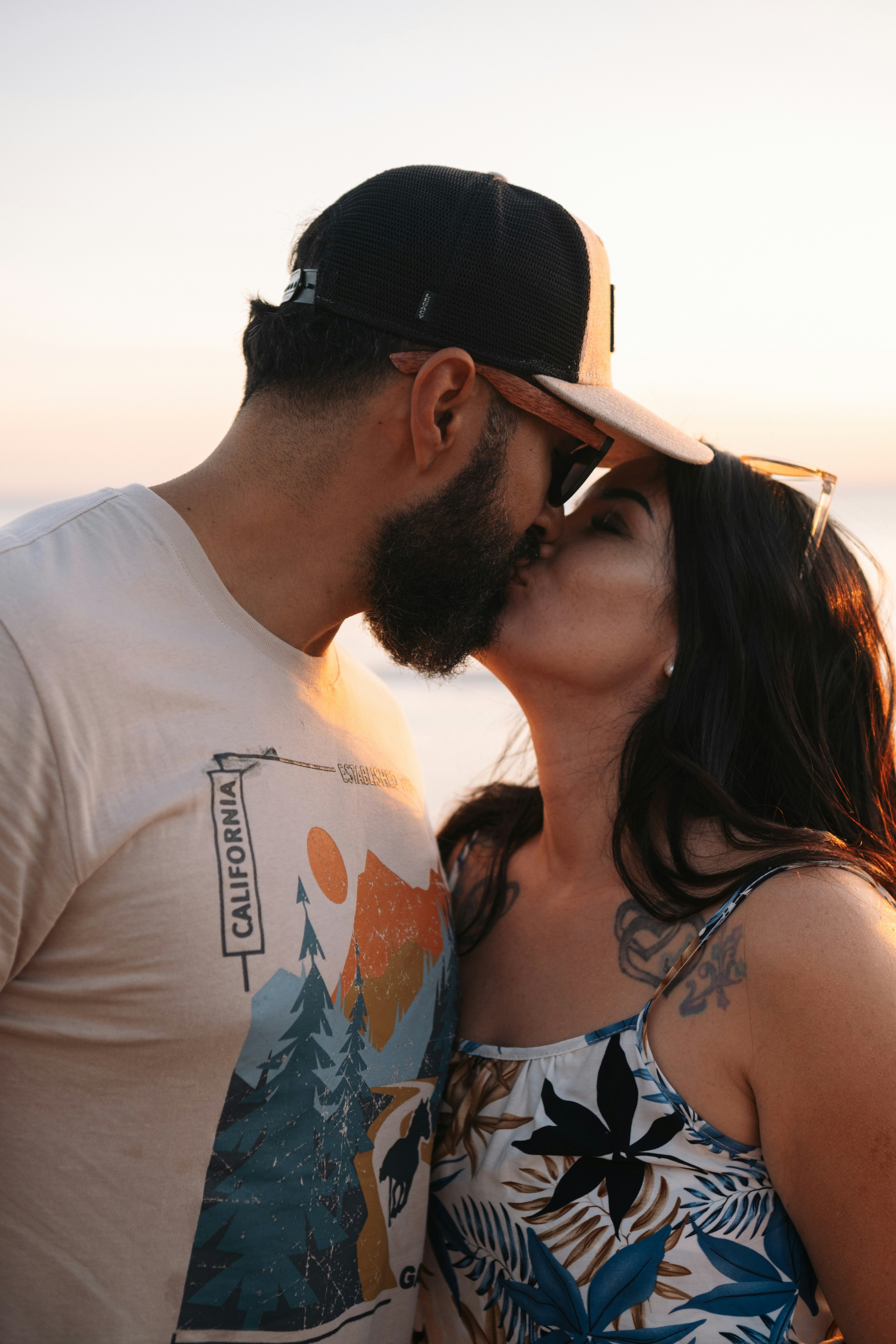 a man kissing a woman on the cheek