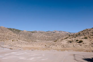 A clear, recent photo showing a wide view of raw land in Dateland, AZ under a bright sky.