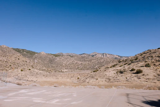 A clear, recent photo showing a wide view of raw land in Dateland, AZ under a bright sky.