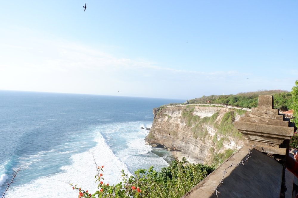 a view of the ocean from the top of a cliff