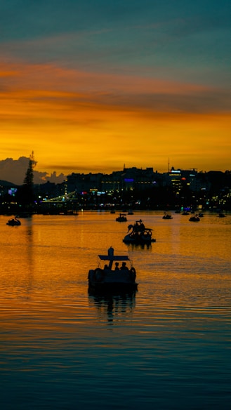 a group of boats floating on top of a body of water