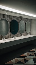 a row of sinks in a public restroom