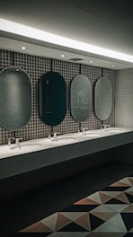 a row of sinks in a public restroom