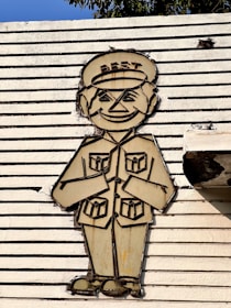 A badge with a friendly character waving, representing greeting skills in social settings.