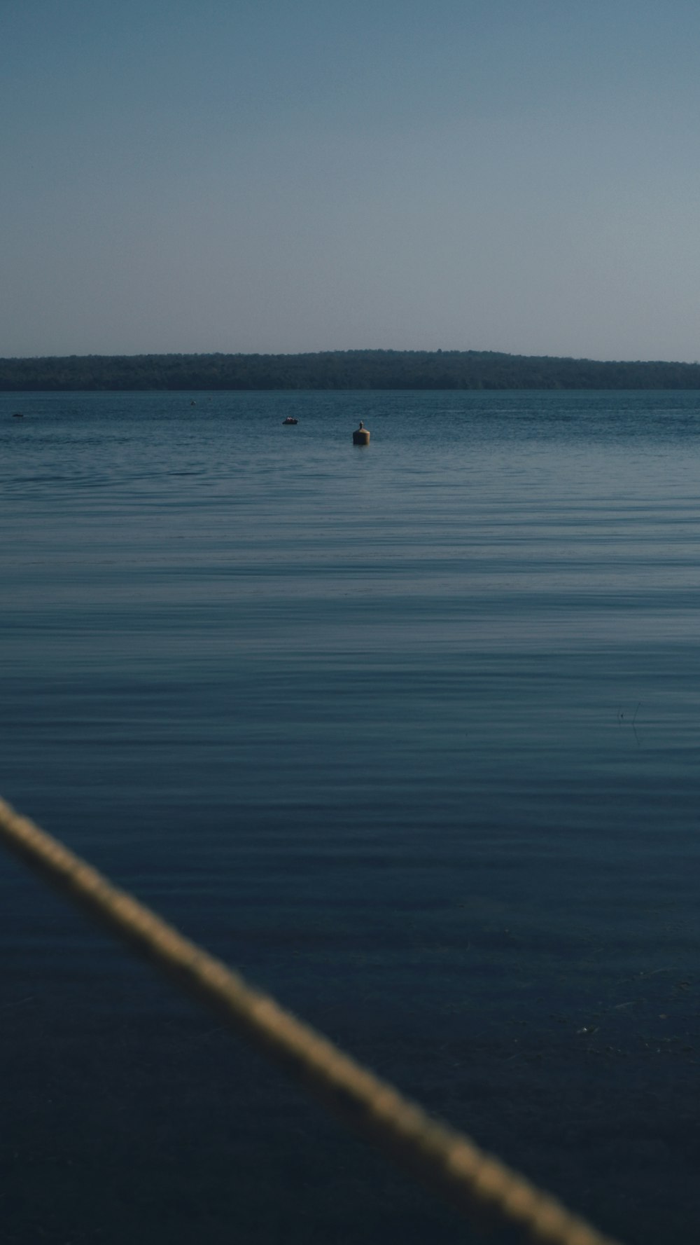 a boat floating on top of a large body of water