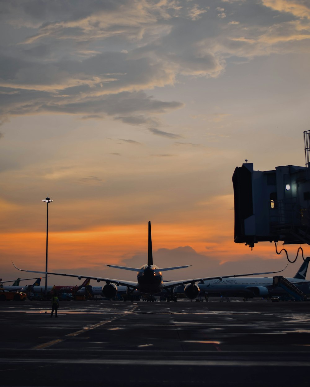 a large jetliner sitting on top of an airport tarmac