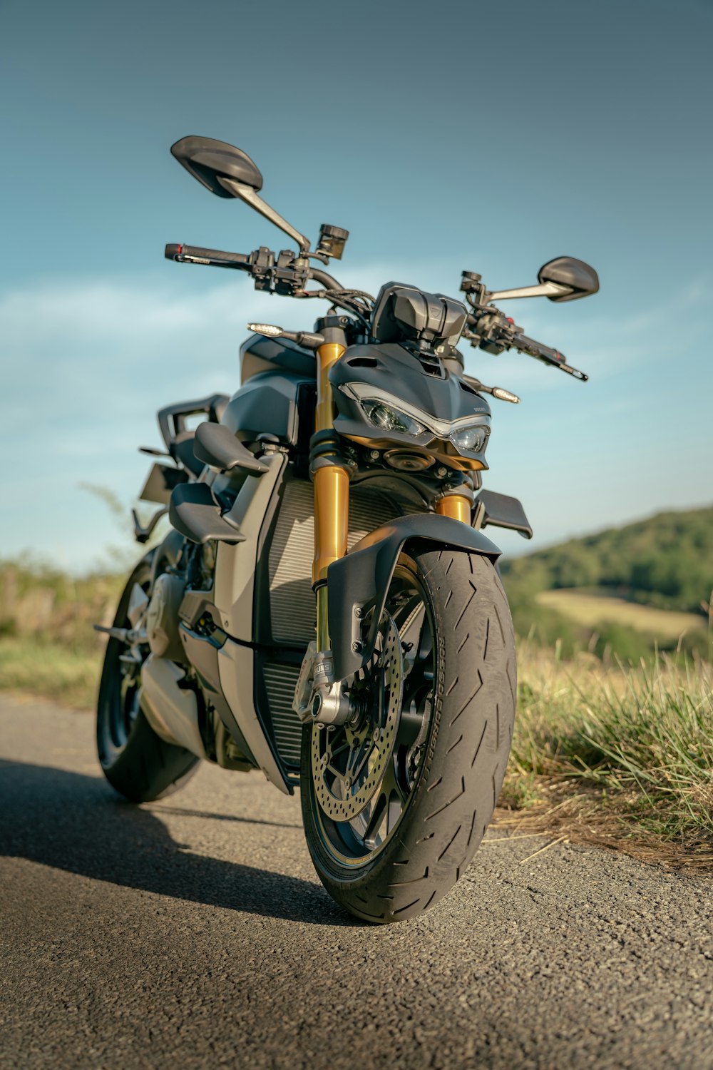 a motorcycle parked on the side of a road