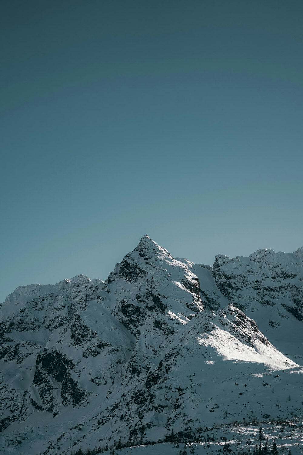 a snow covered mountain with a sky background