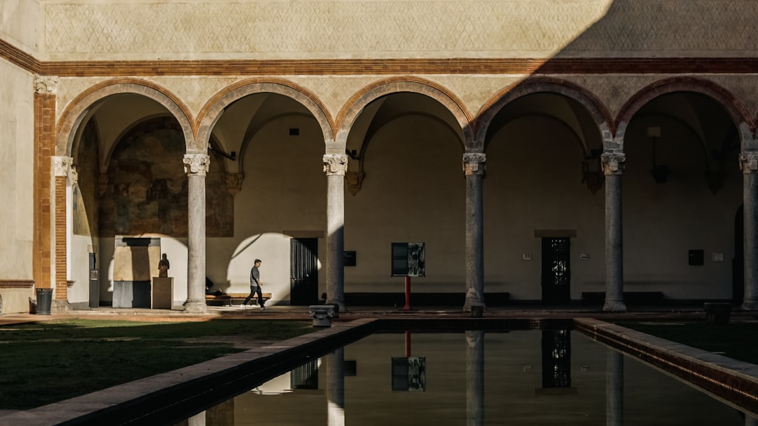 a large building with a pool in the middle of it,