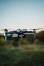 a black and white photo of a remote control flying in the air