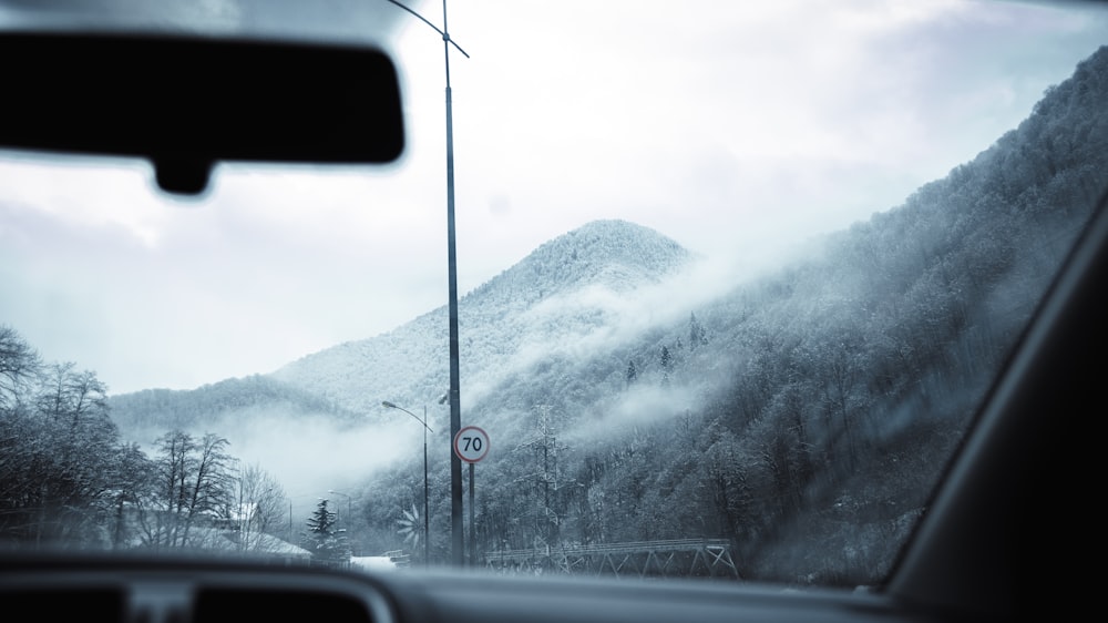 a view from inside a car of a mountain