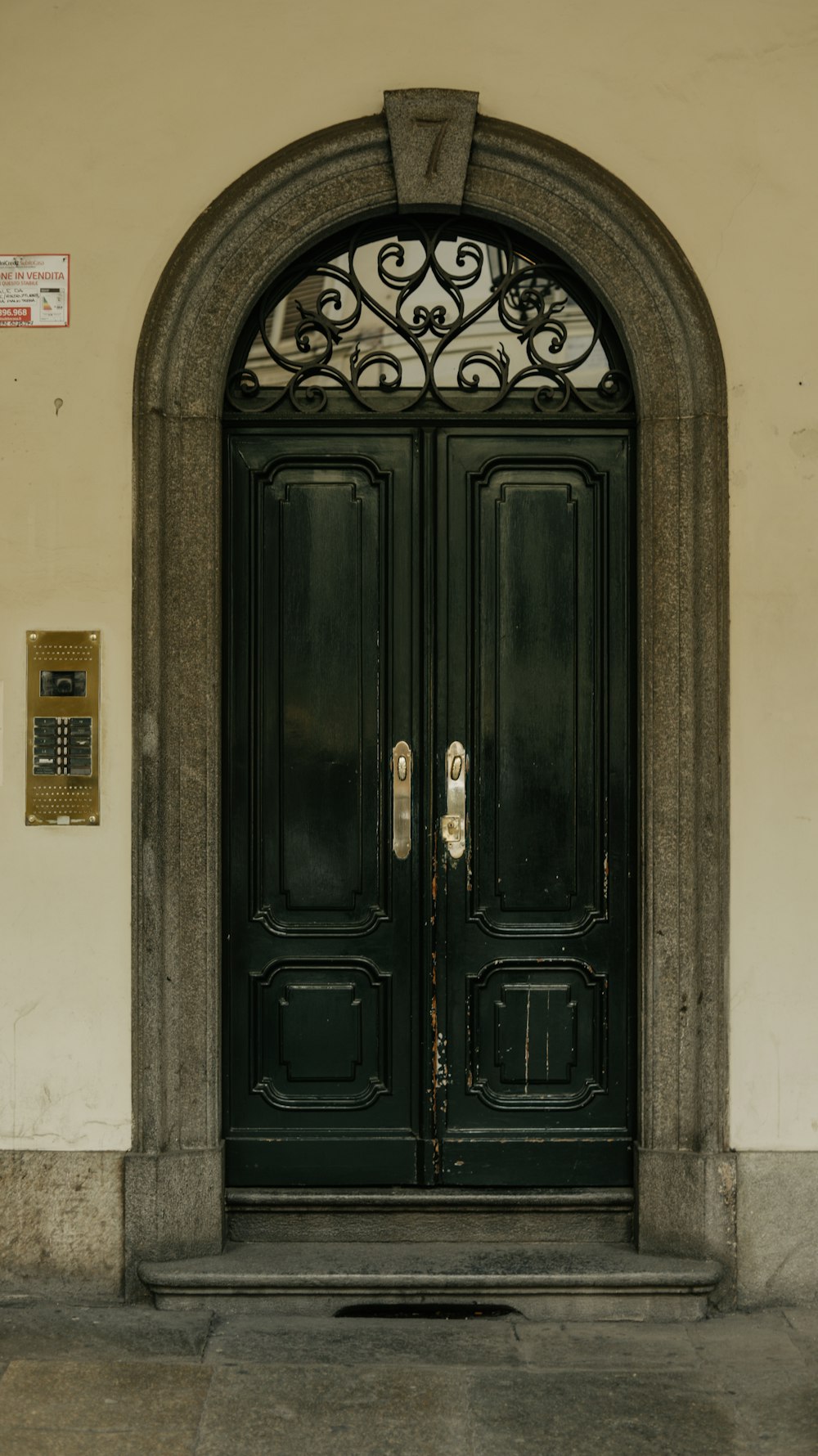 a couple of black doors sitting next to each other