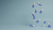a group of pills falling into the air