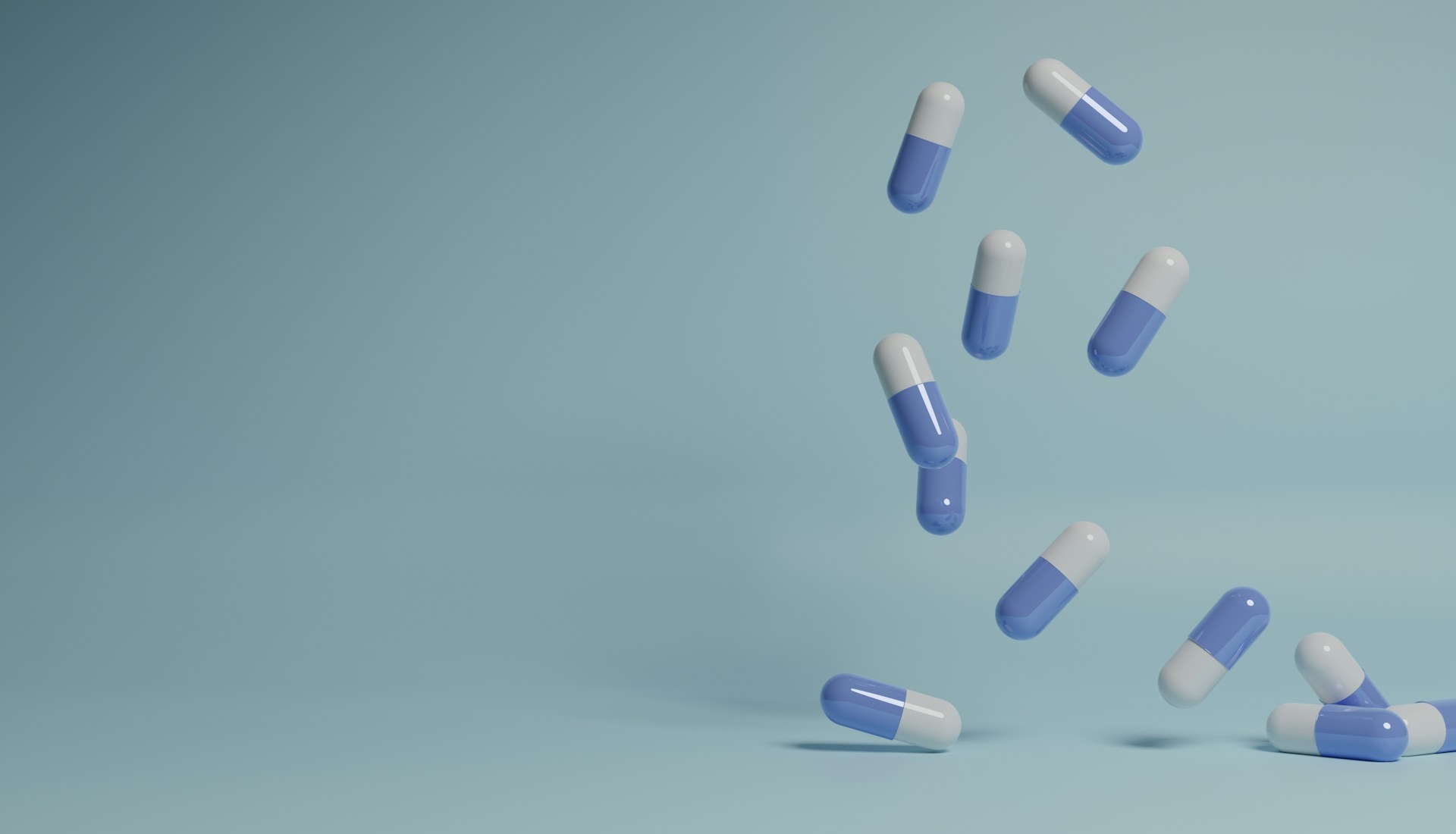 a group of pills falling into the air