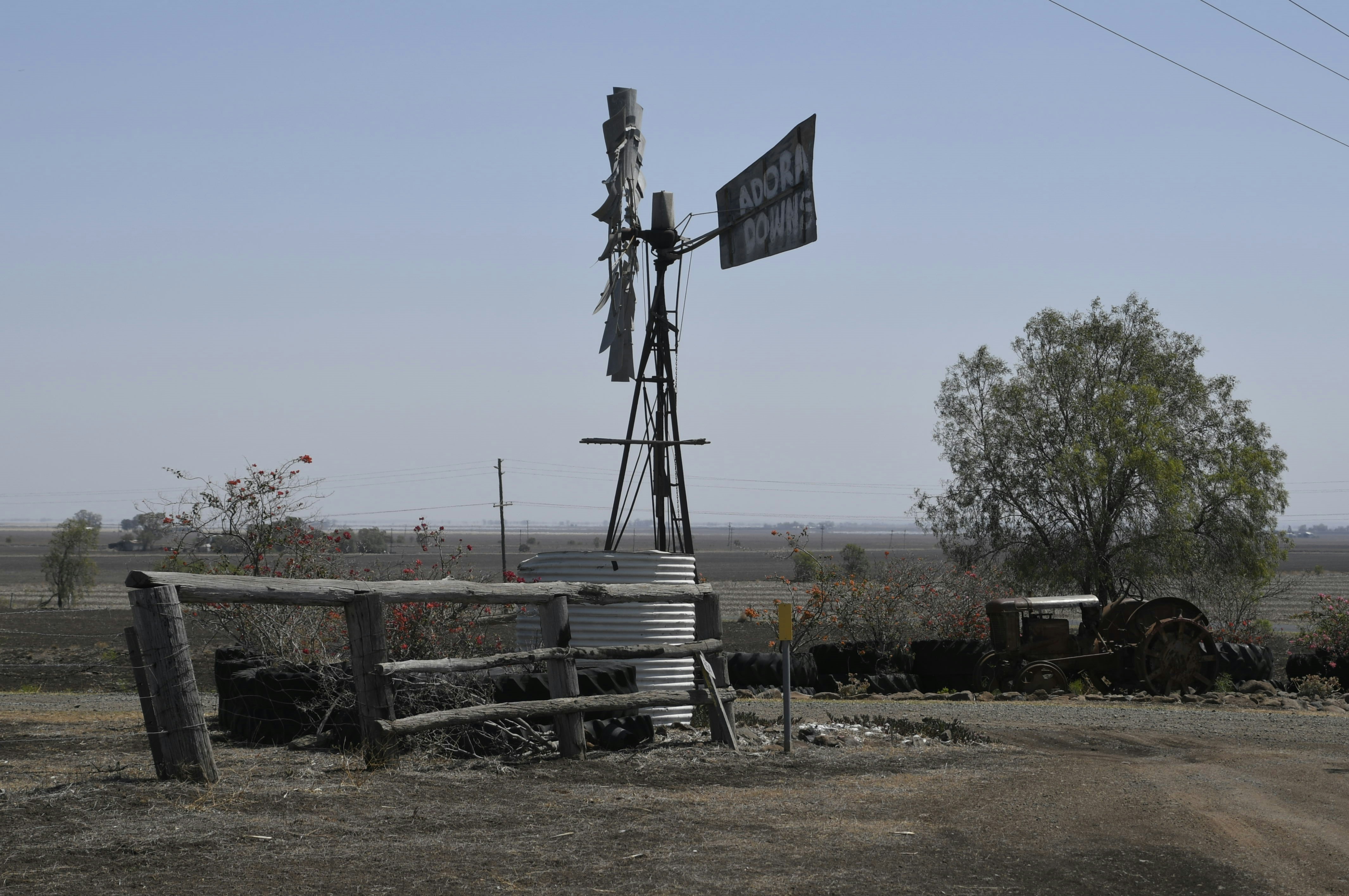 a windmill with a sign on top of it