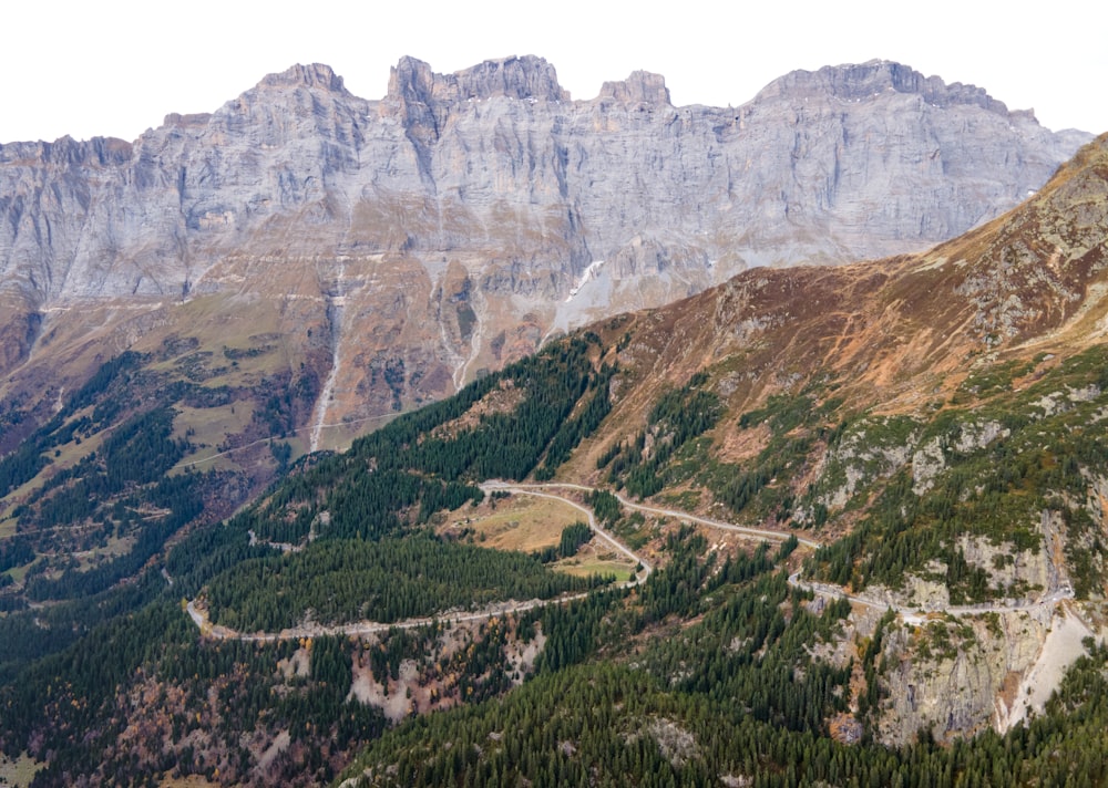 a mountain range with a winding road in the middle