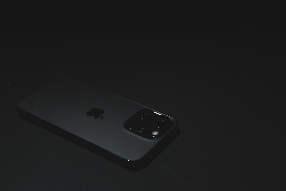 a close up of an iphone in the dark