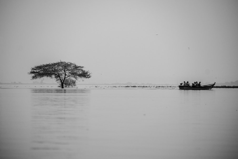 a lone boat floating on top of a large body of water