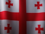a red and white flag with a cross on it