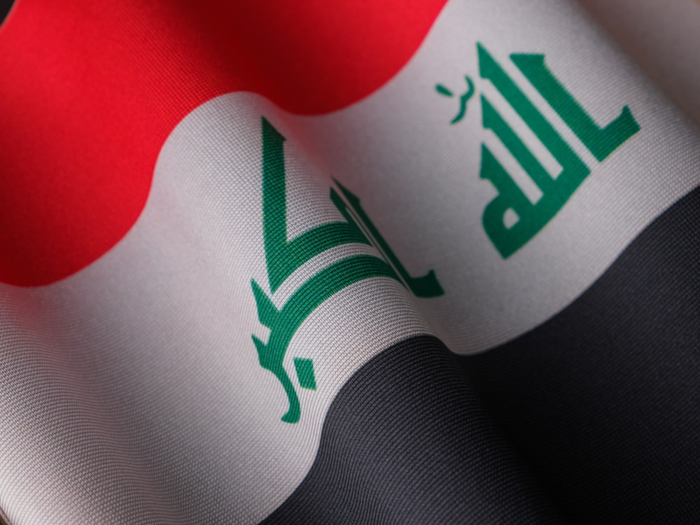 a close up of the flag of iraq